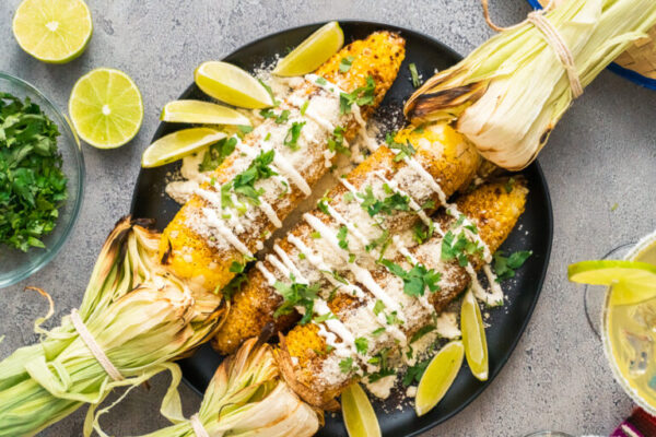 Grilling mexican street corn - Arina Photography