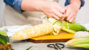 Shucking corn - Arina Photography