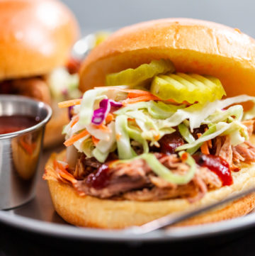 BBQ pulled pork sandwich - Arina Photography BBQ pulled pork sandwich with coleslaw on brioche buns.