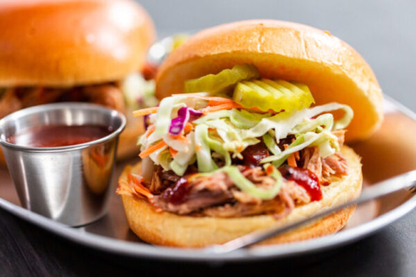 BBQ pulled pork sandwich with coleslaw on brioche buns.