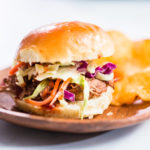 BBQ pulled pork sandwich in shape of small sliders with brioche buns.