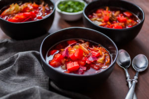 Beet soup - Arina Photography Borscht soup in a black bowl for dinner.