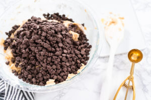 Baking cookies - Arina Photography Mixing ingredients in a glass mixing bowl to bake chocolate chip cookies.