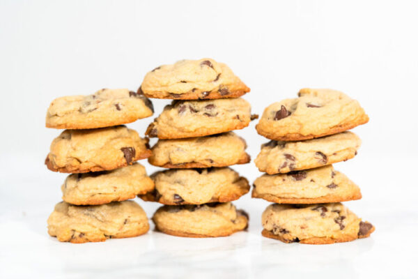 Baking cookies - Arina Photography Stack of homemade soft chocolate chip cookies.