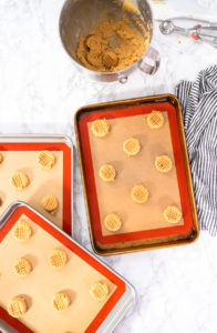 Peanut butter cookies - Arina Photography Peanut butter cookie dough spaced evenly on baking tray before baking