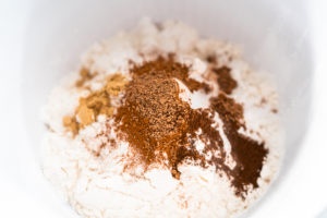 Pumpkin spice cupcake - Arina Photography Ingredients to bake pumpkin spice cupcake on a marble countertop.