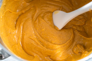 Pumpkin spice cupcake - Arina Photography Pumpkin spice cupcake batter in a mixing bowl with rubber spatula.