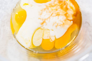 Bowl with eggs, buttermilk, and vanilla before whisking