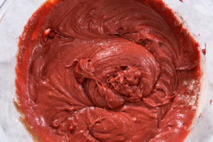 Red cake batter in large mixing bowl