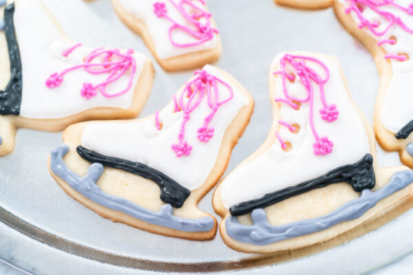 Sugar cookies - Arina Photography Decorating sugar cookies shaped as figure skates with royal icing.