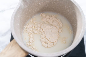 Baking brioche buns - Arina Photography Preparing tangzhong in a small saucepan to bake homemade bread.