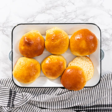 Baking brioche buns - Arina Photography Flat lay. Freshly baked brioche buns on a metal serving tray.