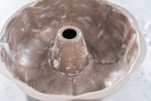 Bundt cake pan thoroughly greased with vegetable shortening, ready for batter.
