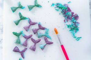 Homemade chocolate mermaid tails covered with glitter dust.