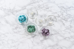 Flat lay. Ingredients in a glass mixing bows to make chocolate mermaid tails.