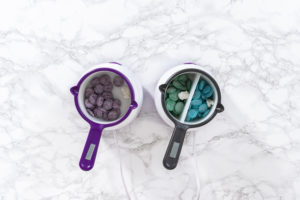 Flat lay. Melting chocolate chips in a candy melting pot to make chocolate mermaid tails.