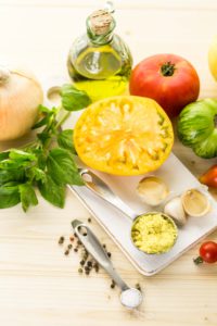 Ingredients to make roasted tomato soup with organic heirloom tomatoes.