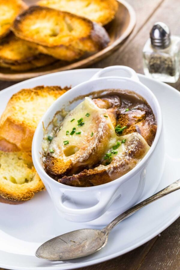 French Onion Soup - Arina Photography Homemade French onion soup with toasted baguette.