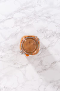 Flat lay. Preparing cinnamon sugar in a glass mason jar.