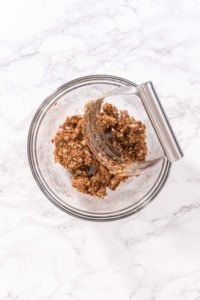 Cinnamon Dessert Pizza - Arina Photography Mixing the cinnamon spread ingredients together with a pastry blender until crumbly.