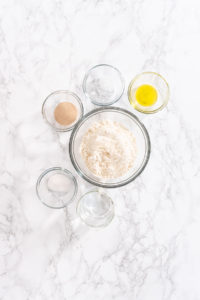 Cinnamon Dessert Pizza - Arina Photography Overhead view of ingredients measured for cinnamon spread, including brown sugar, oats, butter, and cinnamon.