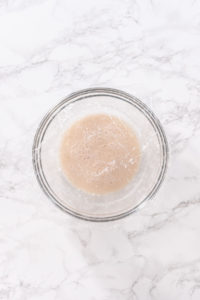 Cinnamon Dessert Pizza - Arina Photography Yeast mixture bubbling in bowl after proofing.