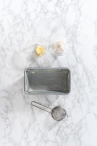 Greasing baking pan - Arina Photography