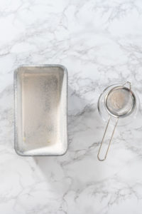 Greasing baking pan - Arina Photography