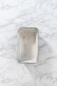 Greasing baking pan - Arina Photography