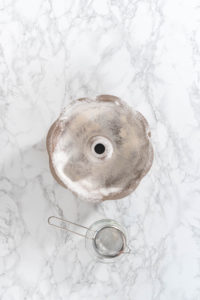 Greasing baking pan - Arina Photography