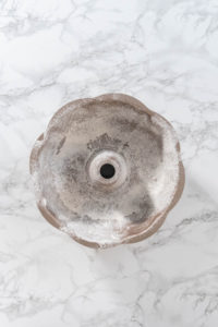 Greasing baking pan - Arina Photography