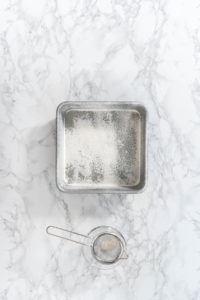 Greasing baking pan - Arina Photography