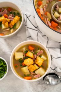 Split Pea Soup - Arina Photography Serving split pea soup in ceramic soup bowls.