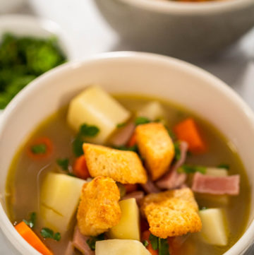 Split Pea Soup - Arina Photography Serving split pea soup in ceramic soup bowls.