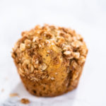 Freshly baked banana oatmeal muffins with oatmeal sugar topping.