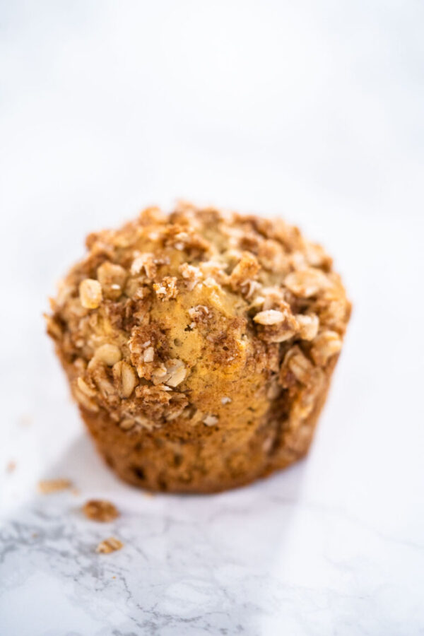 Banana Oatmeal Muffins - Arina Photography Freshly baked banana oatmeal muffins with oatmeal sugar topping.