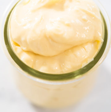Cream cheese filling for bundt cake in small glass jat.