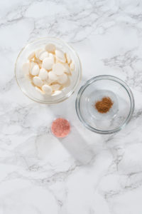 Eggnog Cookies - Arina Photography Flat lay. Measured ingredients in glass mixing bowls to make a chocolate gingerbread man.