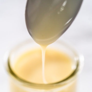 White chocolate ganache - Arina Photography White chocolate ganache in a small glass mason jar.
