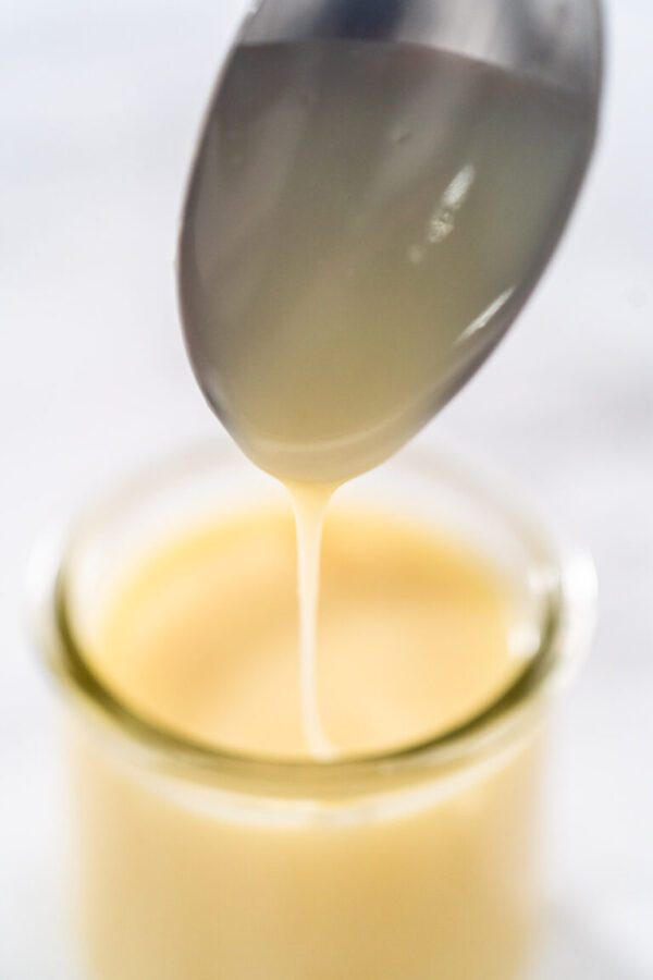 White chocolate ganache - Arina Photography White chocolate ganache in a small glass mason jar.
