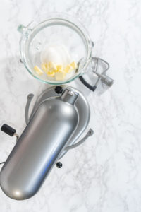 Lemon Wedge Cookies - Arina Photography Mixing butter, lemon juice, and sugar in stand mixer bowl.