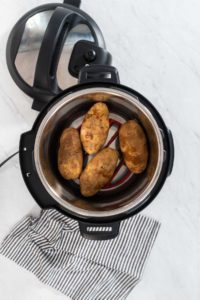 Pressure Cooker Baked Potatoes - Arina Photography Flat lay. Pressure Cooker Baked Potatoes. Cooking whole potatoes in a pressure cooker to make baked potatoes.