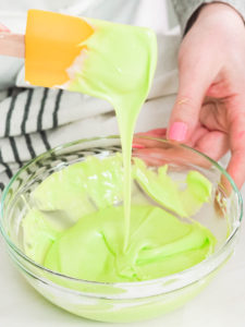 Making Easter cookies - Arina Photography Step by step. Flat lay. Mixing royal icing to decorate Easter sugar cookeis.