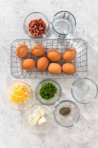 Egg bites - Arina Photography Flat lay. Measured ingredients in glass mixing bowls to make egg bites.