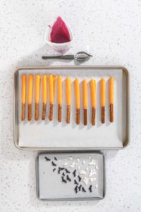 Halloween chocolate-covered pretzel rods - Arina Photography