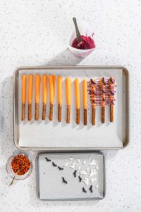 Halloween chocolate-covered pretzel rods - Arina Photography