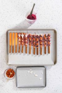 Halloween chocolate-covered pretzel rods - Arina Photography
