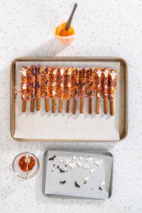 Halloween chocolate-covered pretzel rods - Arina Photography