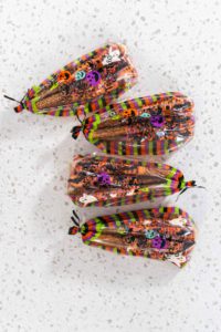 Halloween chocolate-covered pretzel rods - Arina Photography