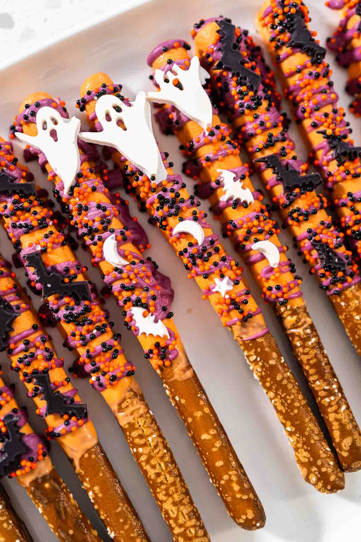 Halloween chocolate-covered pretzel rods - Arina Photography
